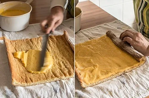 Masa brazo reina Masa de bizcocho delgada y ligeramente dorada sobre papel mantequilla, lista para ser enrollada.